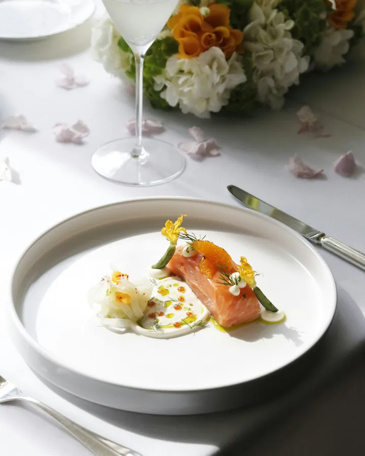 A delicate fillet finished with herbs and a clear broth poured at the table.