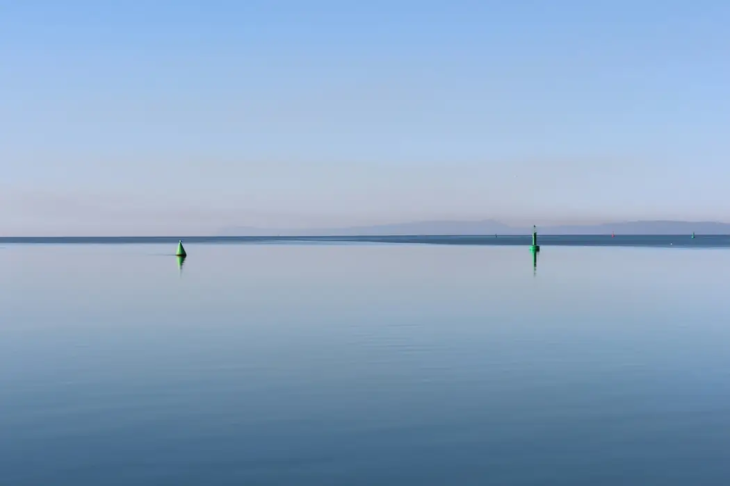 The Mediterranean at its stillest, the horizon barely separating water from sky.